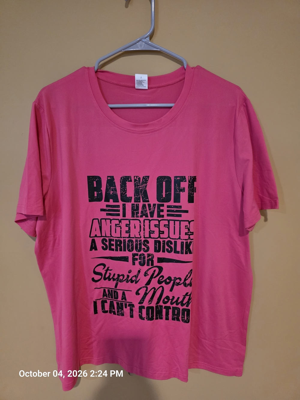 Women’s Pink Short-Sleeve Graphic Tee with Bold Black Slogan